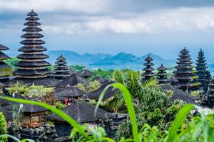 Hindu temple roofs in front of foggy mountains