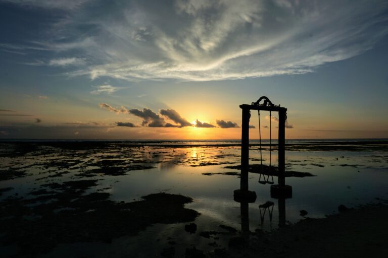 Swing on the seashore with a sunset