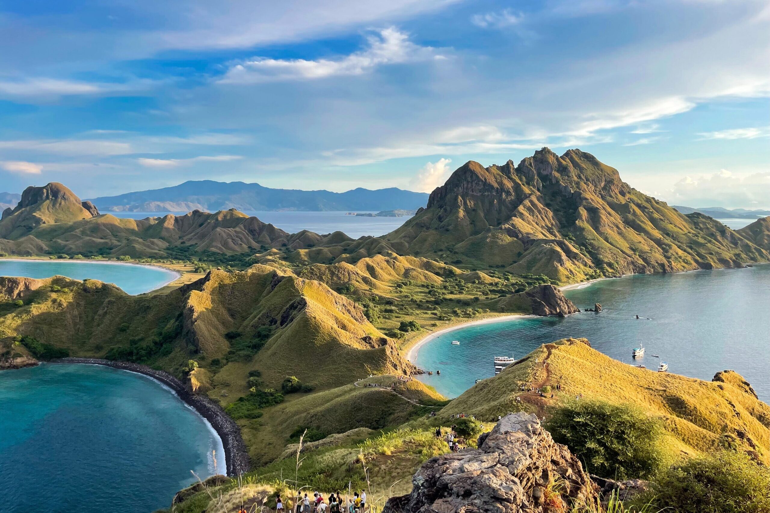 Pulau Padar's bays, beaches and green hills from above on a clear day